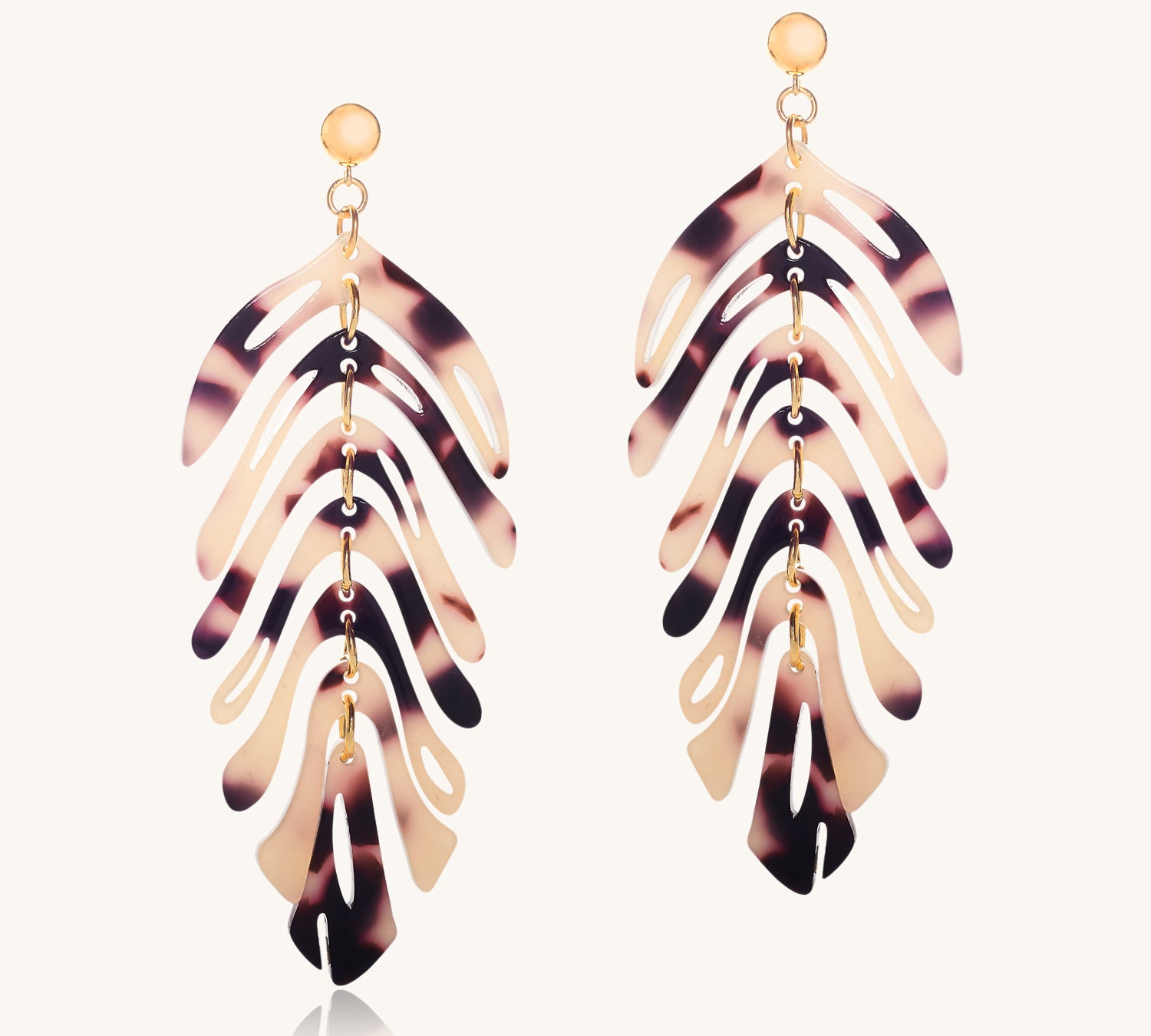 Tortoiseshell leaf-shaped earrings on a white background
