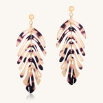 Tortoiseshell leaf-shaped earrings on a white background