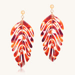 Tortoiseshell leaf-shaped earrings on a white background