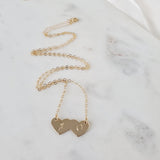 Two hearts become one necklace