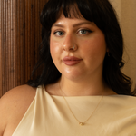 model wearing gold filled ball necklace on beige top