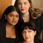 three models in black clothes wearing various necklaces