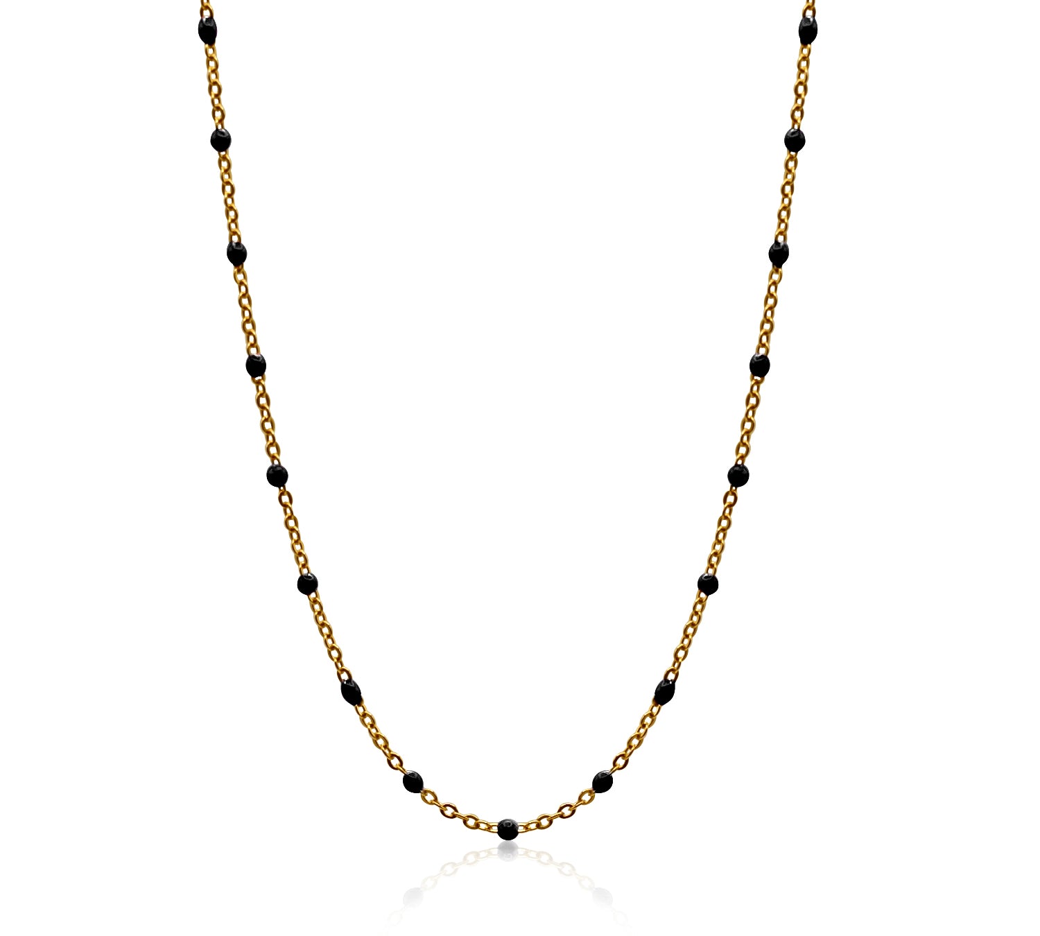 Gold chain necklace with black beads on a white background