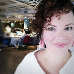 Woman with curly hair in an office setting